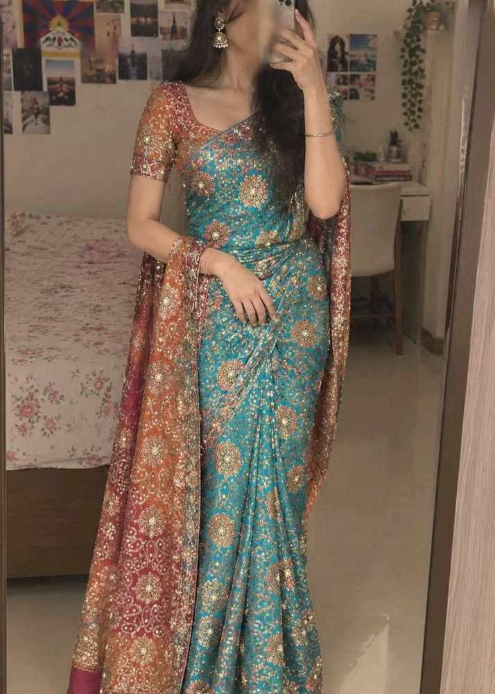 Stunning Teal Saree with Intricate Embellishments