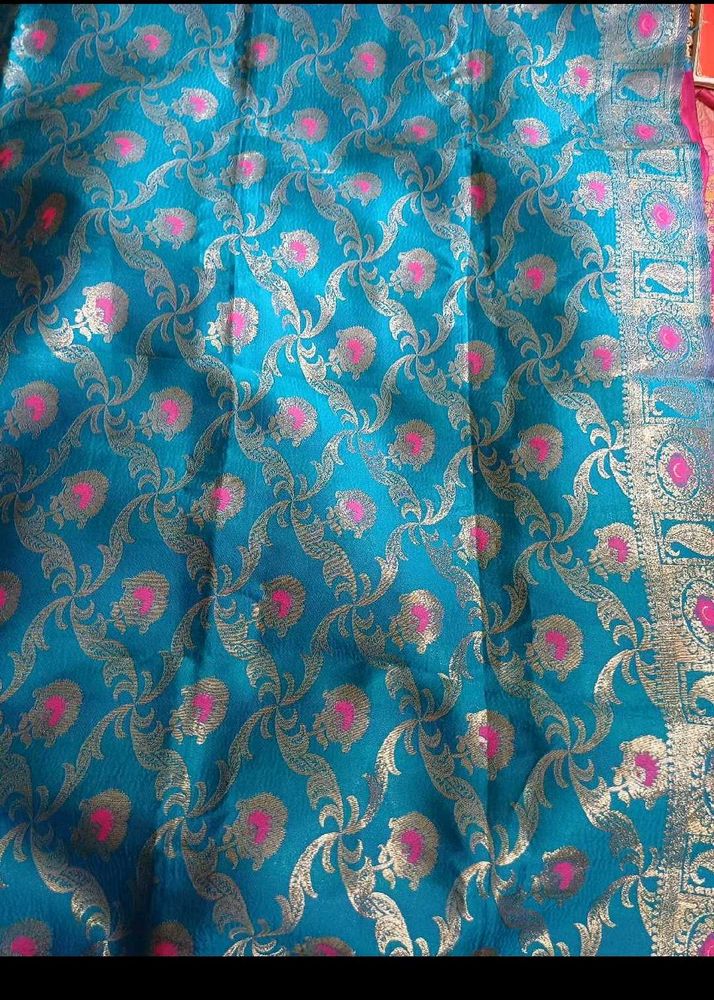 Elegant Teal Saree with Gold &amp; Pink Motifs