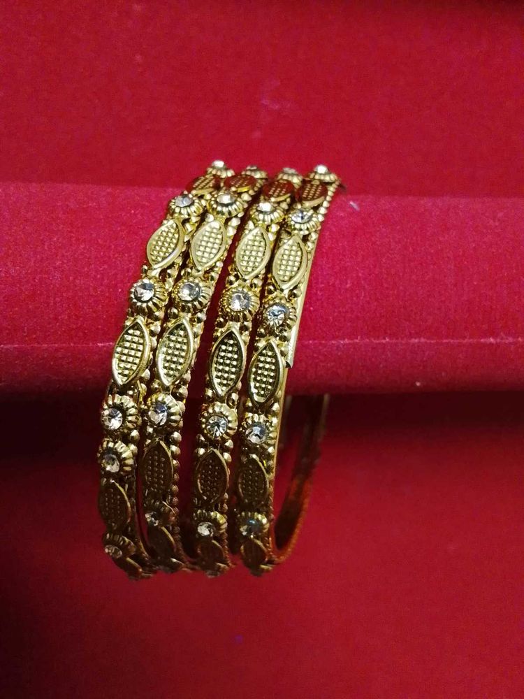 Elegant Gold Tone Bangles with Stones