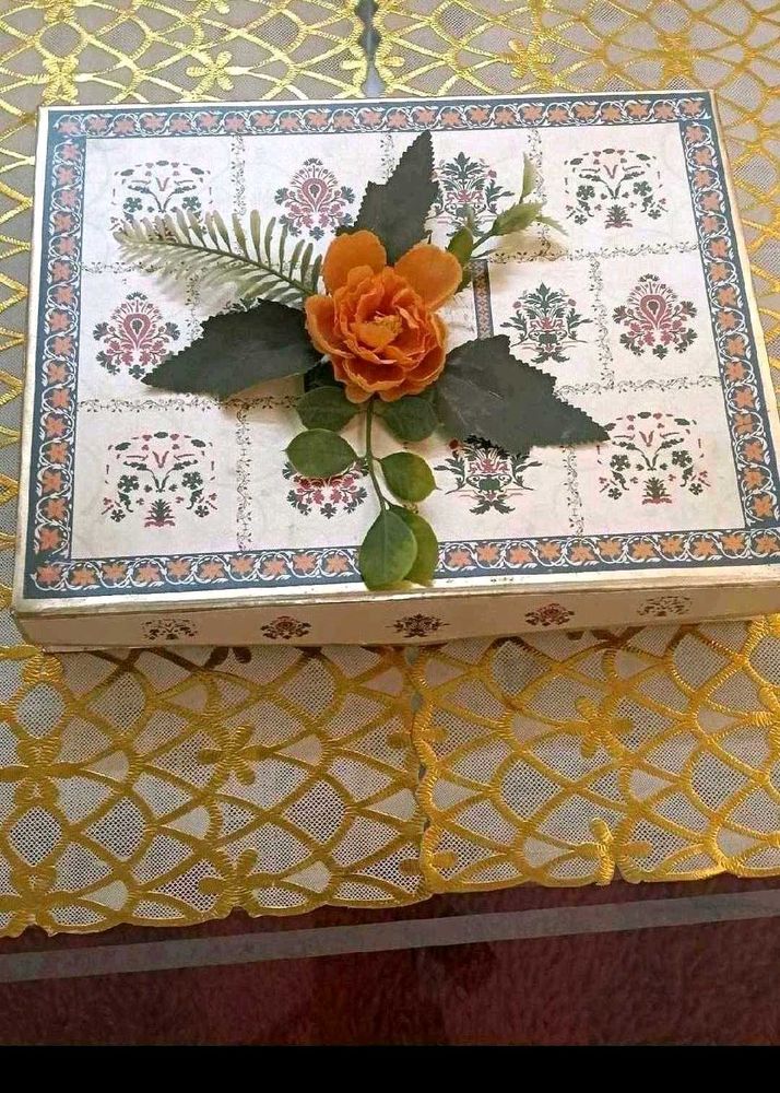 10. Decorative Gift Box with Floral Accent