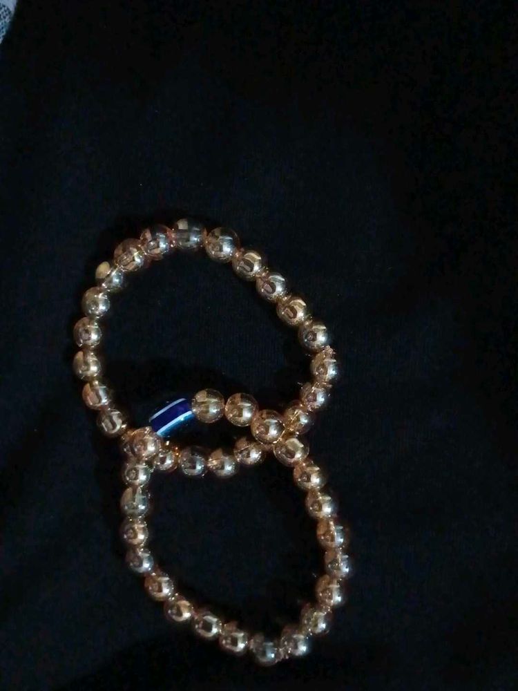 Gold Beaded Bracelet with Blue Accent