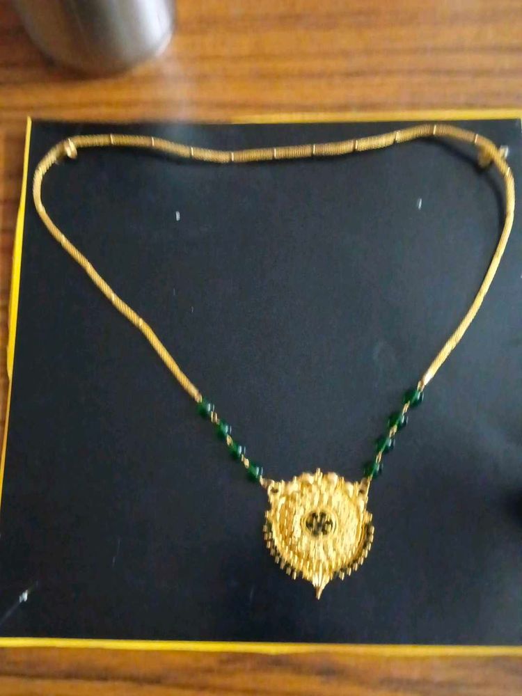 Elegant Gold Necklace with Green Beads