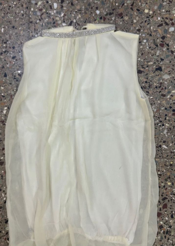 Elegant Cream Gown with Embellished Neckline
