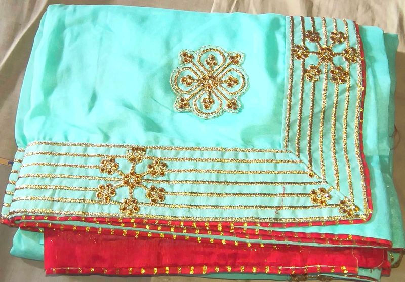 Stunning Teal Saree with Gold Embellishments