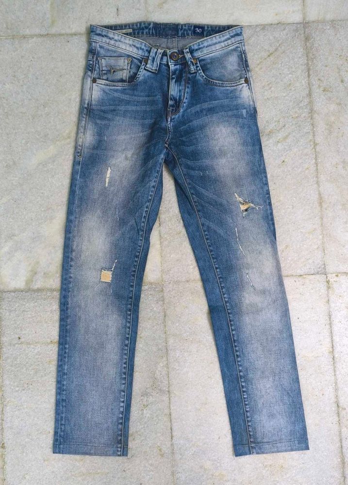 Distressed Blue Denim Jeans