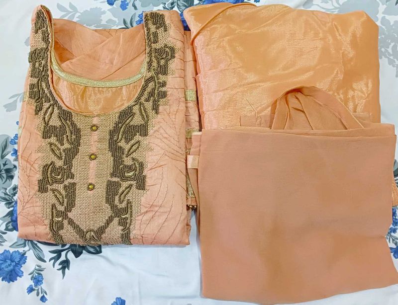 Elegant Peach Kurta Set with Intricate Embroidery