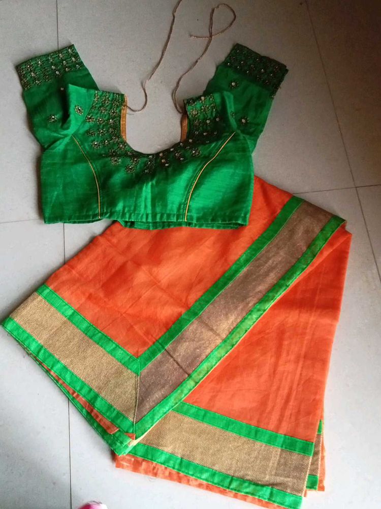 Vibrant Orange Saree with Embellished Blouse