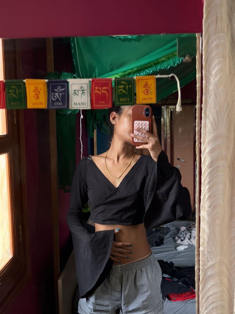 black crop to with long flared sleeves