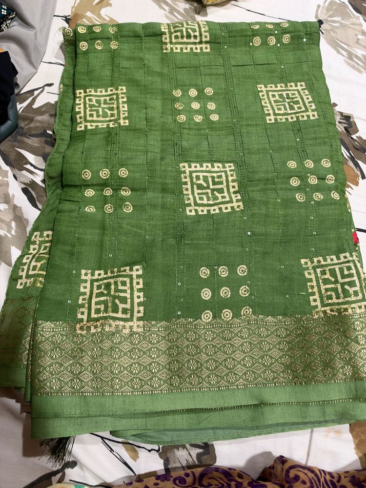 Elegant Green Saree with Intricate Designs