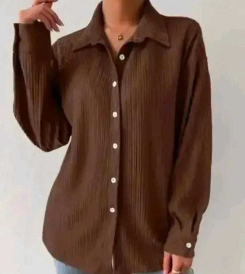 brown shirt with black buttons