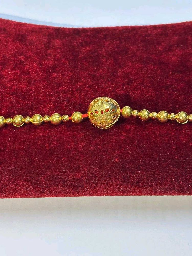 Golden Rakhi Set Of 2