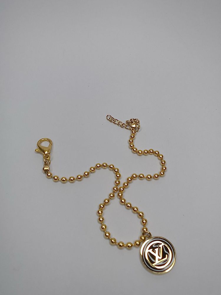 Elegant Gold Beaded Bracelet with Charm