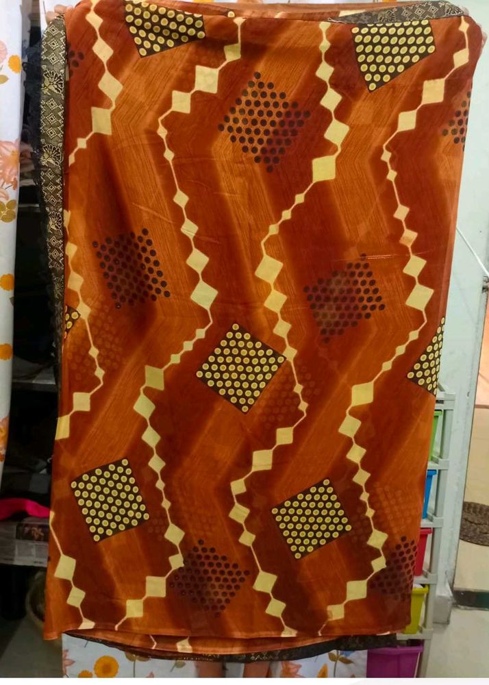 Beautiful Orange Saree with Unique Print