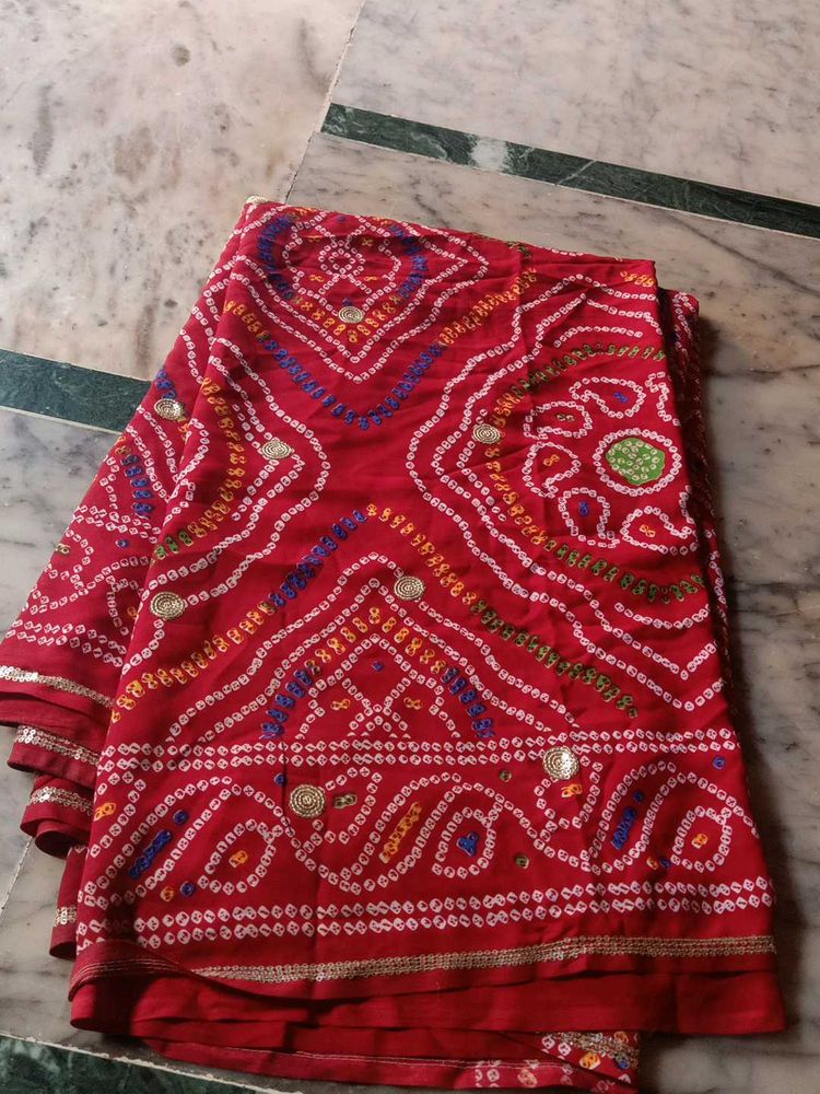 Vibrant Red Bandhani Saree with Intricate Designs
