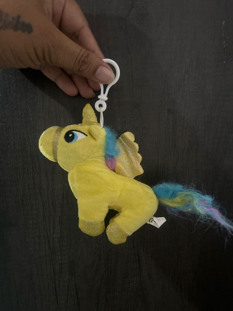 small yellow plush unicorn