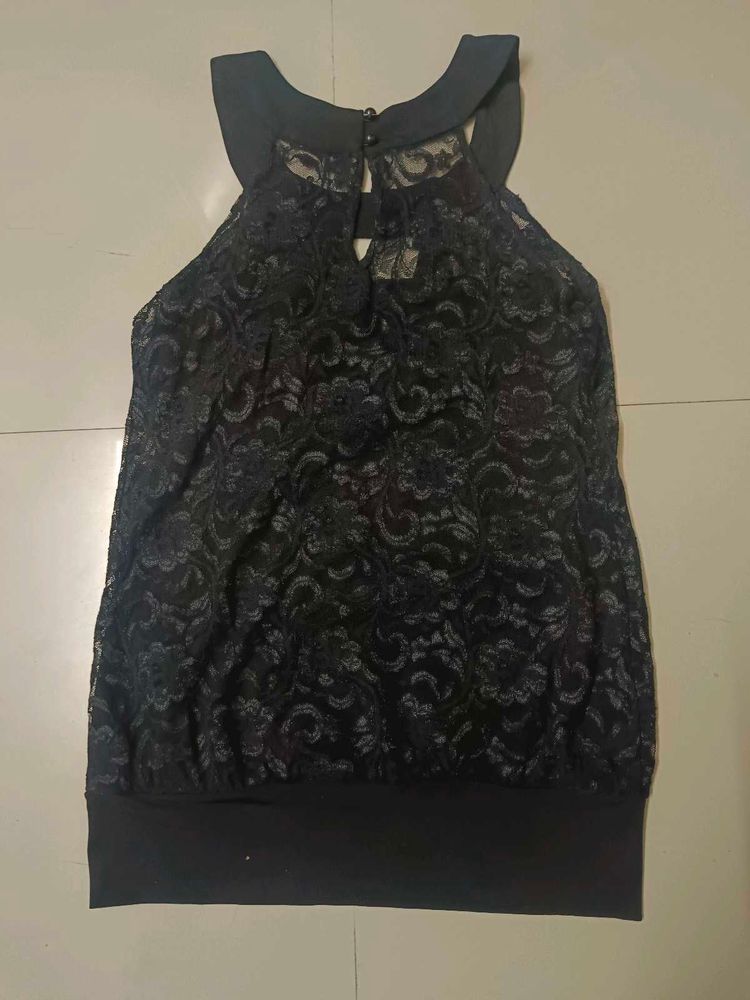 Black halter neck top.