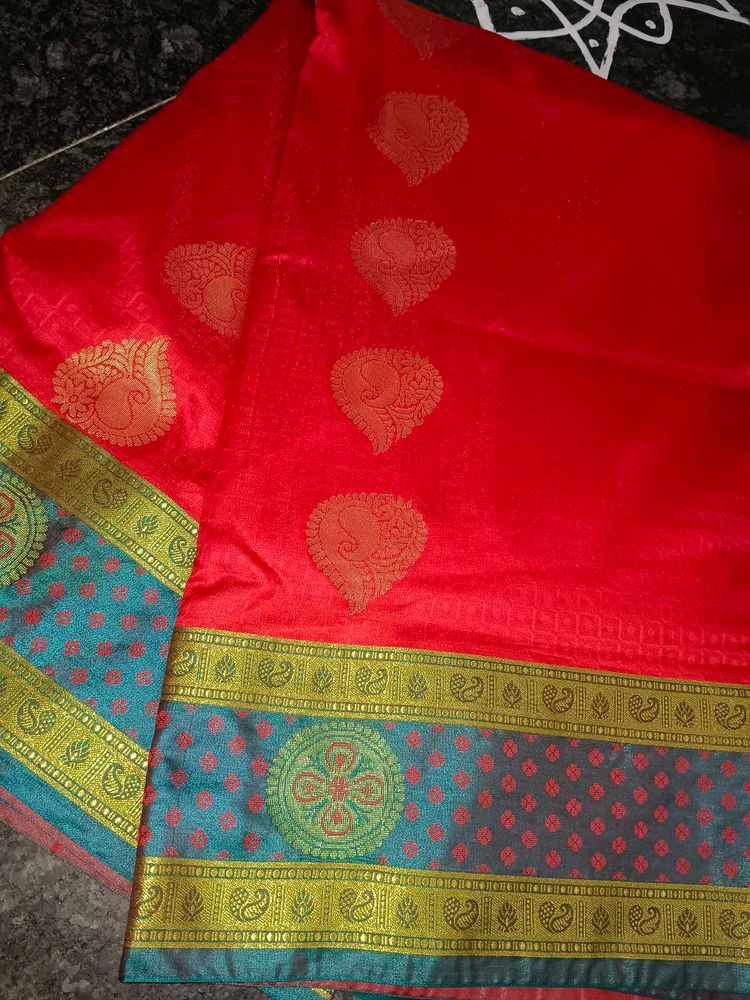 Vibrant Red Saree with Teal Border