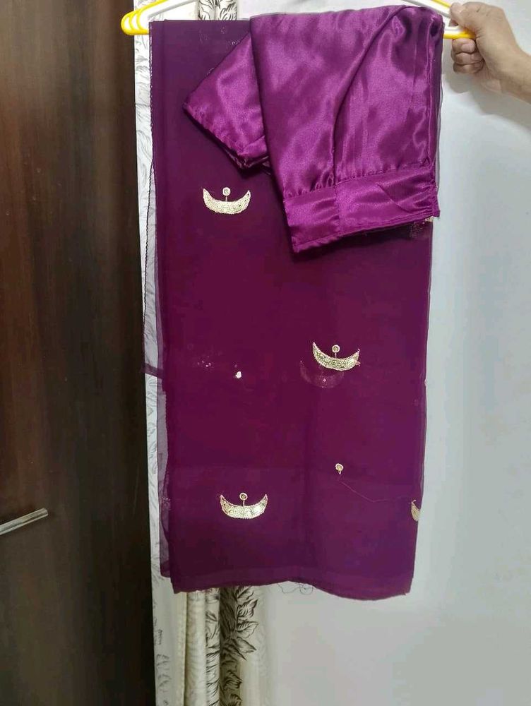 Elegant Purple Saree with Gold Embellishments