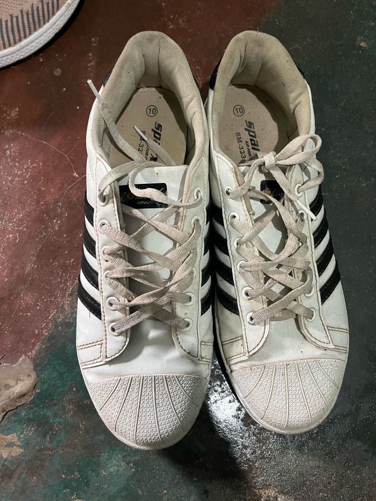 White Sneakers with Black Stripes
