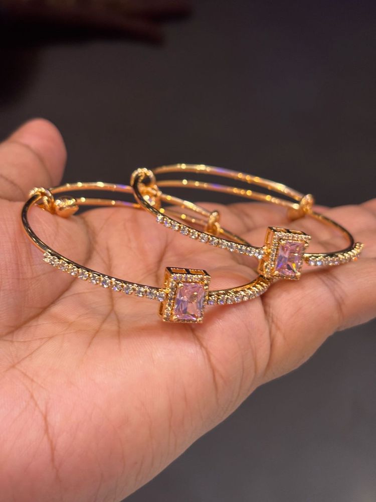 Elegant Gold Bangles with Pink Stones