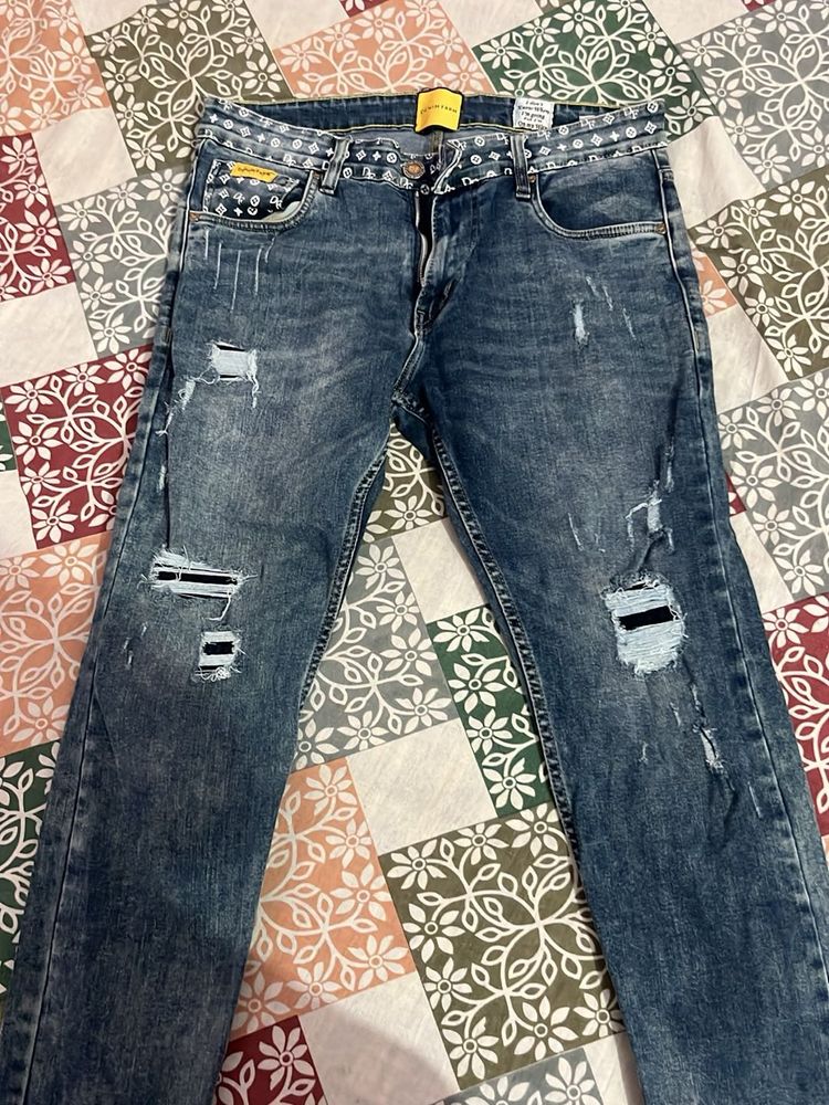 Distressed Blue Denim Jeans