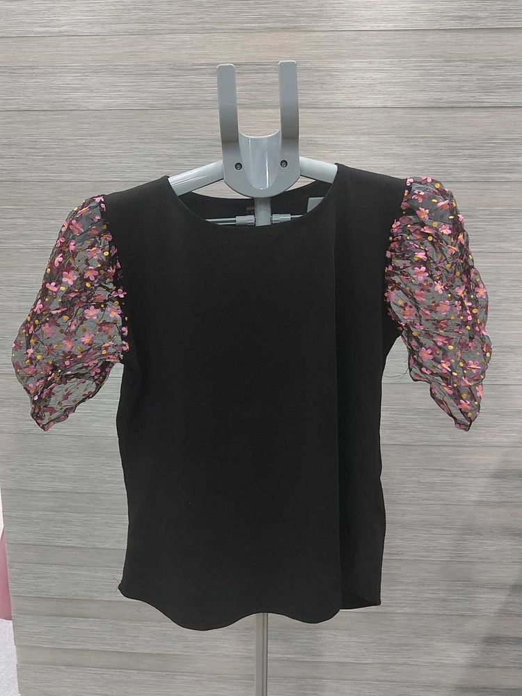 Chic Black Top with Floral Puff Sleeves
