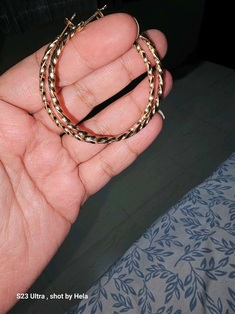 Gold Tone Twisted shiny Hoop Earrings