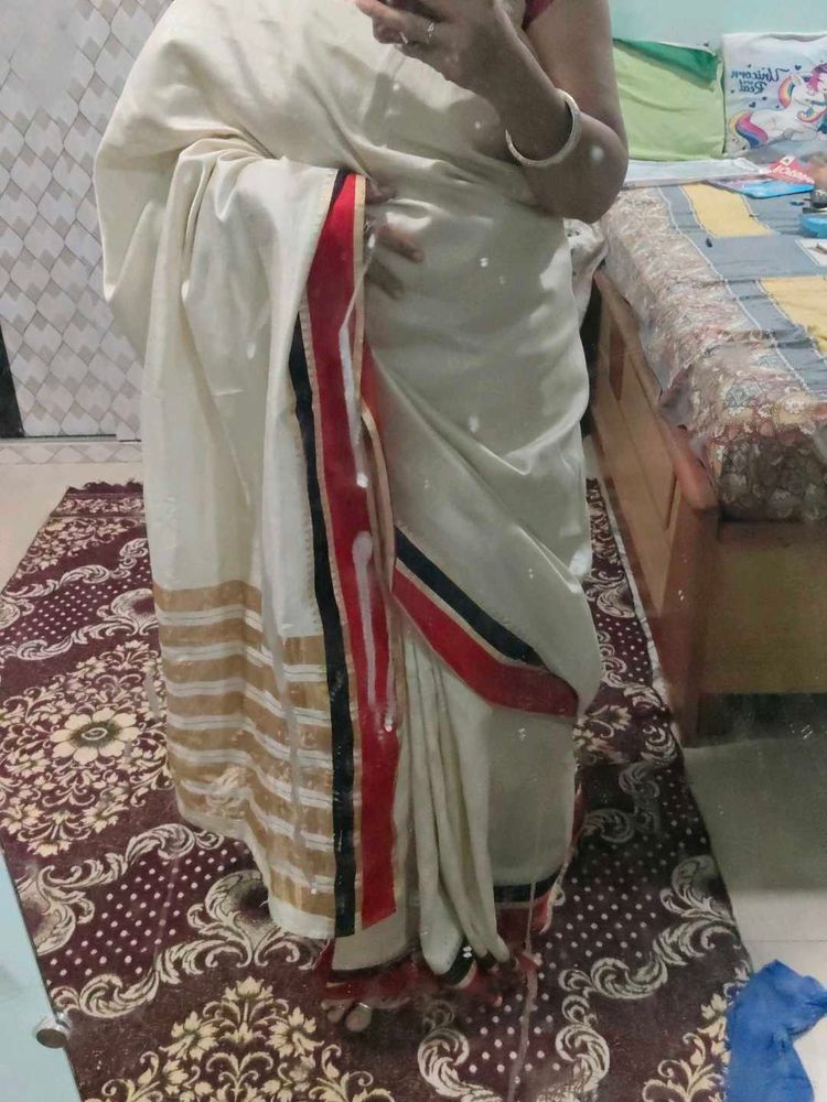 Elegant Cream Saree with Red and Black Border