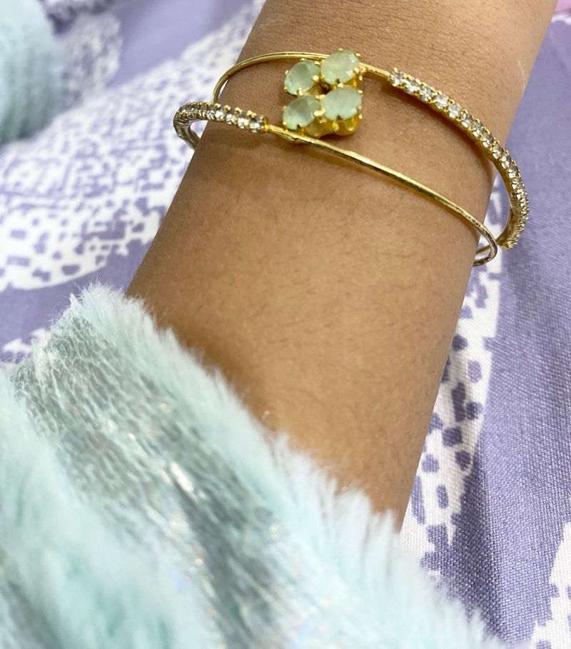 Elegant Gold-Tone Bangle with Gemstones