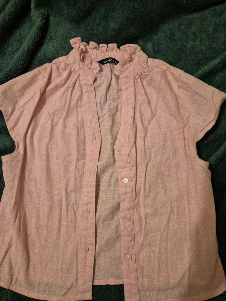 simple plain shirt with cute ruffle like style on