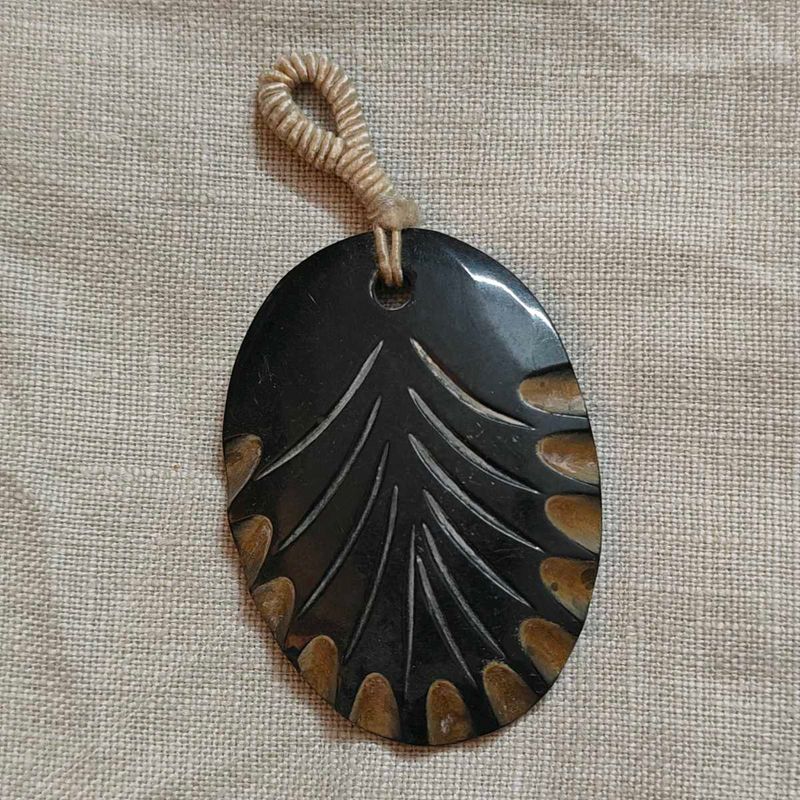 carved bone pendant