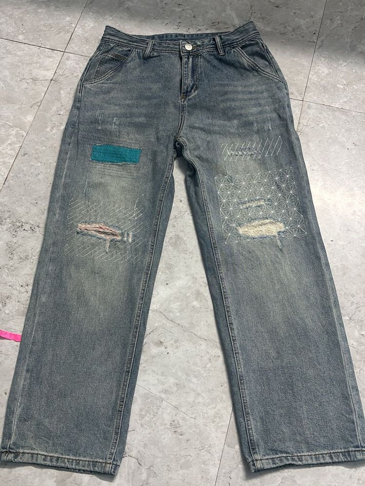 Distressed Patchwork Denim Jeans