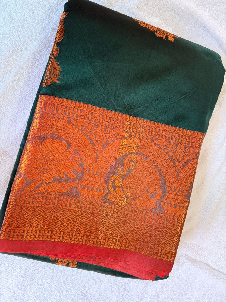 Elegant Dark Green Saree with Reddish maroon Borde