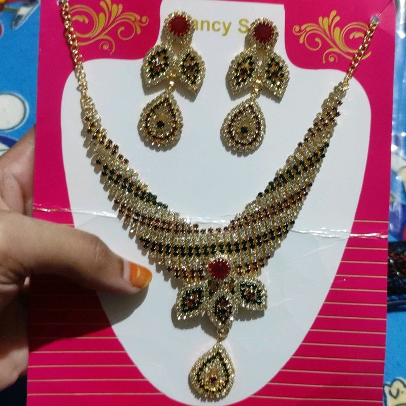 fancy set of necklace and pair of earring
