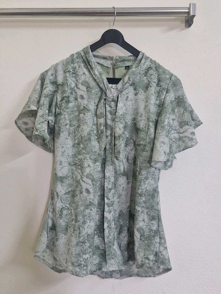 Elegant Green Printed Blouse with Embellished Coll