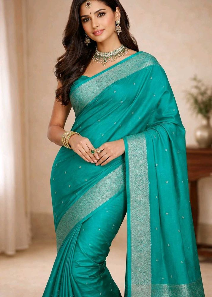 Elegant Teal Saree with Subtle Motifs