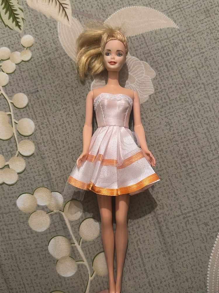 leo Barbie Doll with Pink Dress