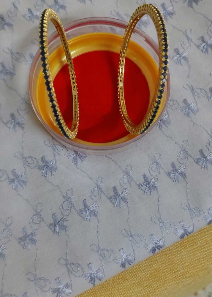 Elegant Gold Bangles with Blue Stones