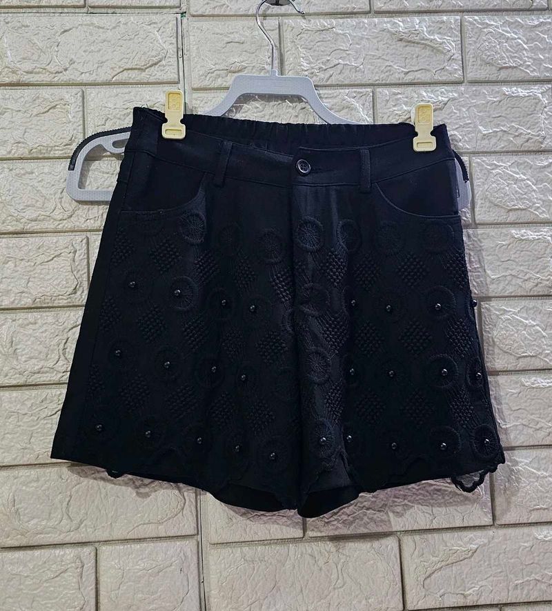 Chic Black Eyelet Shorts with Embellishments