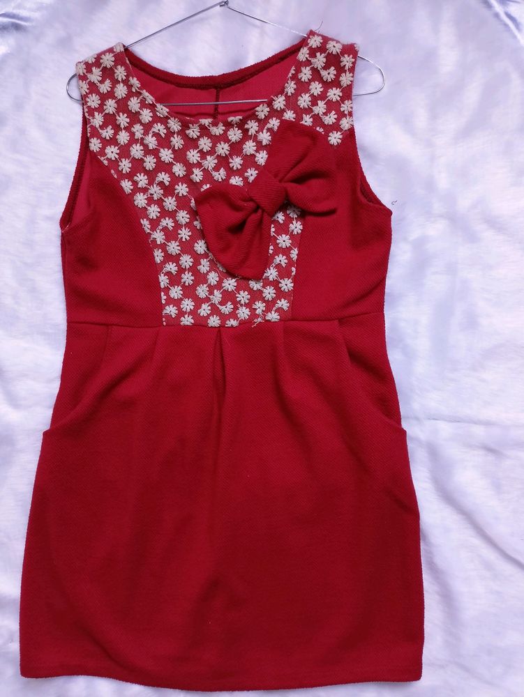 Free Delivery red dress with lace and bow detail.