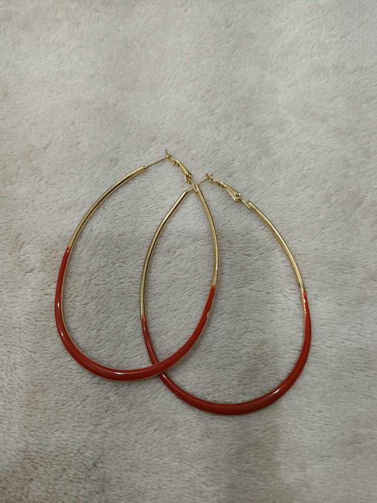 Chic Hoop Earrings with Red Accent