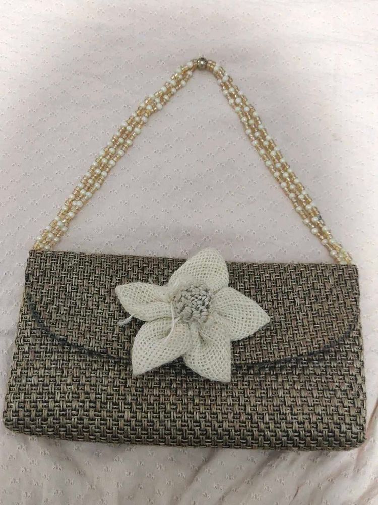 Woven Clutch with Flower Accent