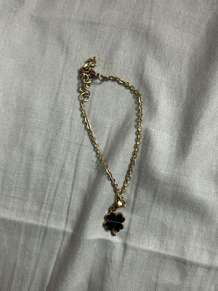 Gold bracelet  with Clover charm