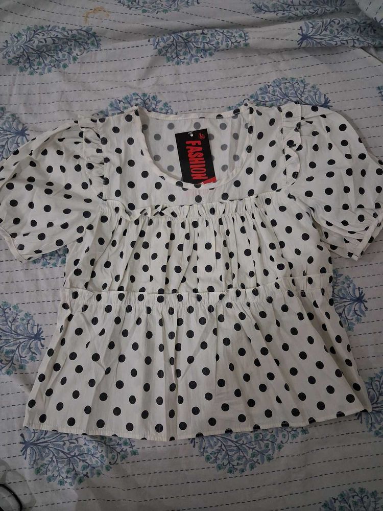 white polka dot top