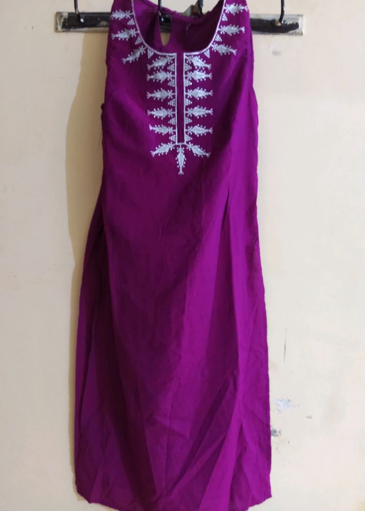 Dark Purple Shiny A Line Kurti Of Size-xs/'s' available...Length Is Just Below The Knee.....Apair Of Sleeves With An Extra Button Available Inside It