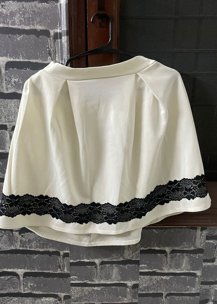 Elegant Off-White Skirt with Black Lace Trim