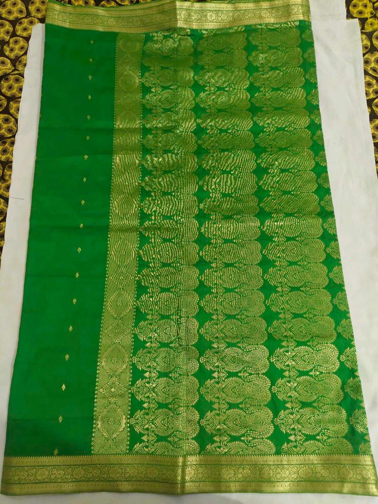 Vibrant Green Silk Saree with Golden Border
