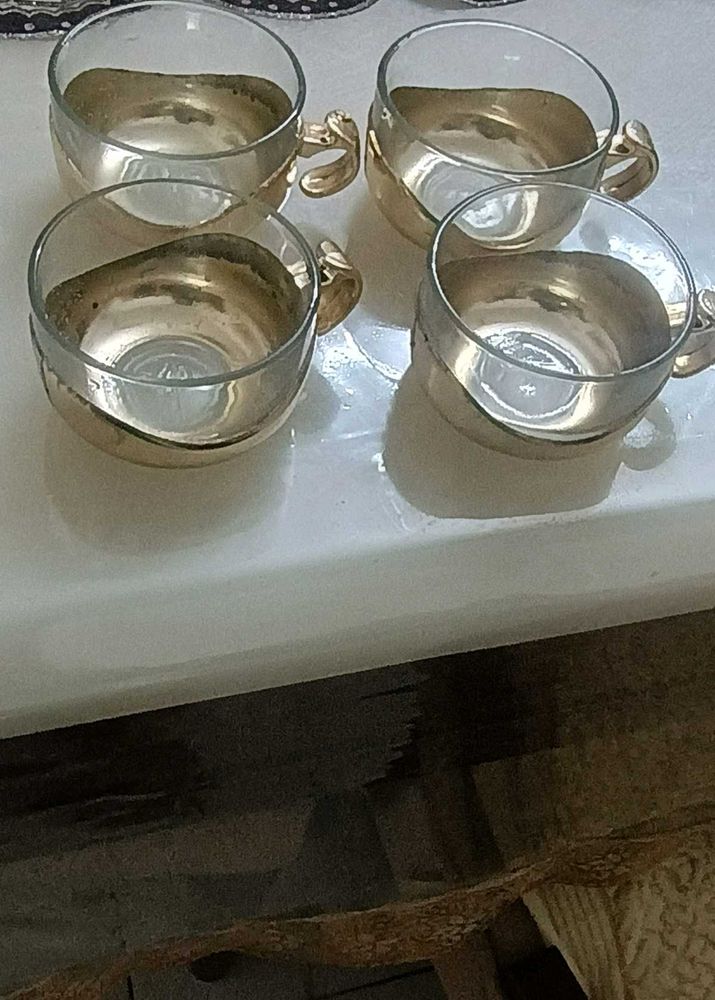 Four golden Glass cups