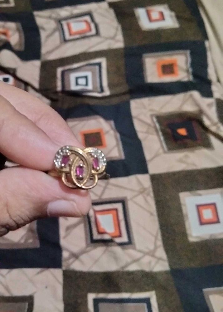 Elegant Gold Ring with Ruby Accents