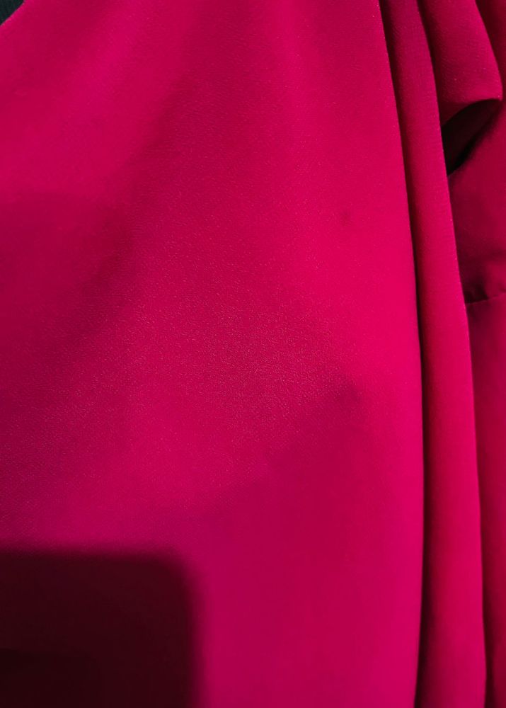 pink top with flared sleeves